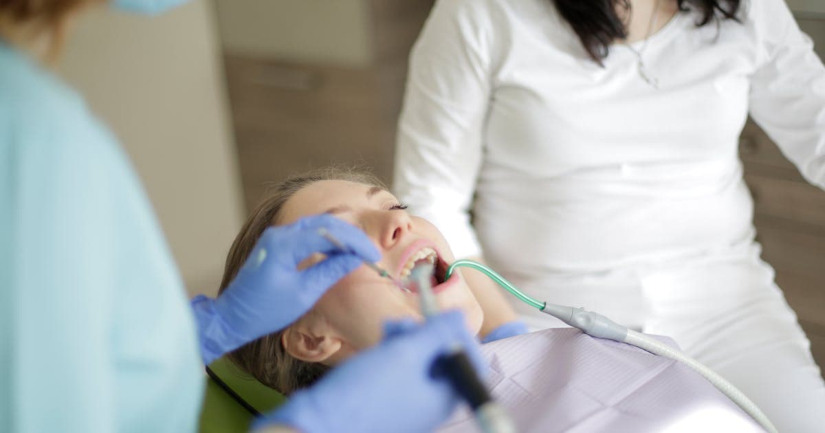 Chiropractor performing spinal adjustment on a patient