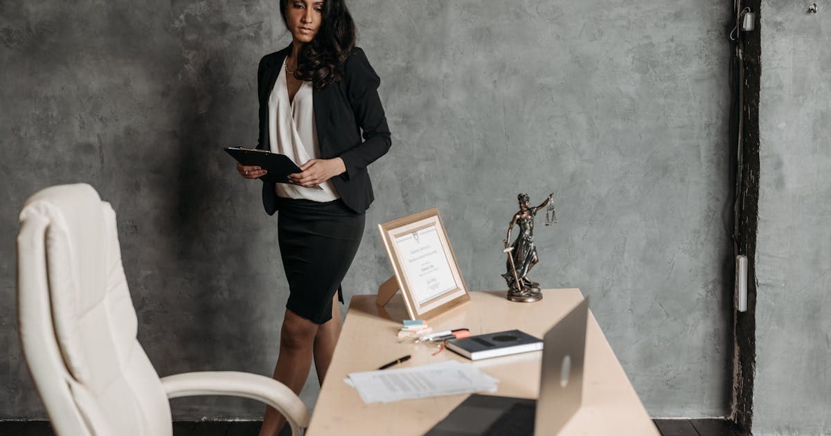 Defense attorney consulting with a client in a private office