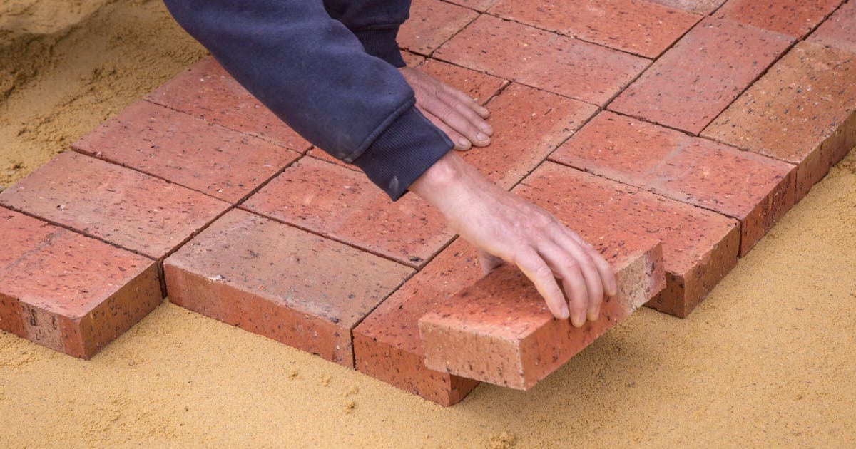 Foundation repair specialist inspecting a home's structure