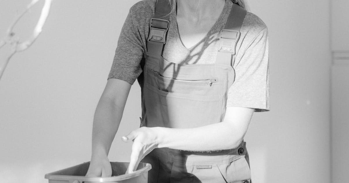 Pest control technician treating a residential property