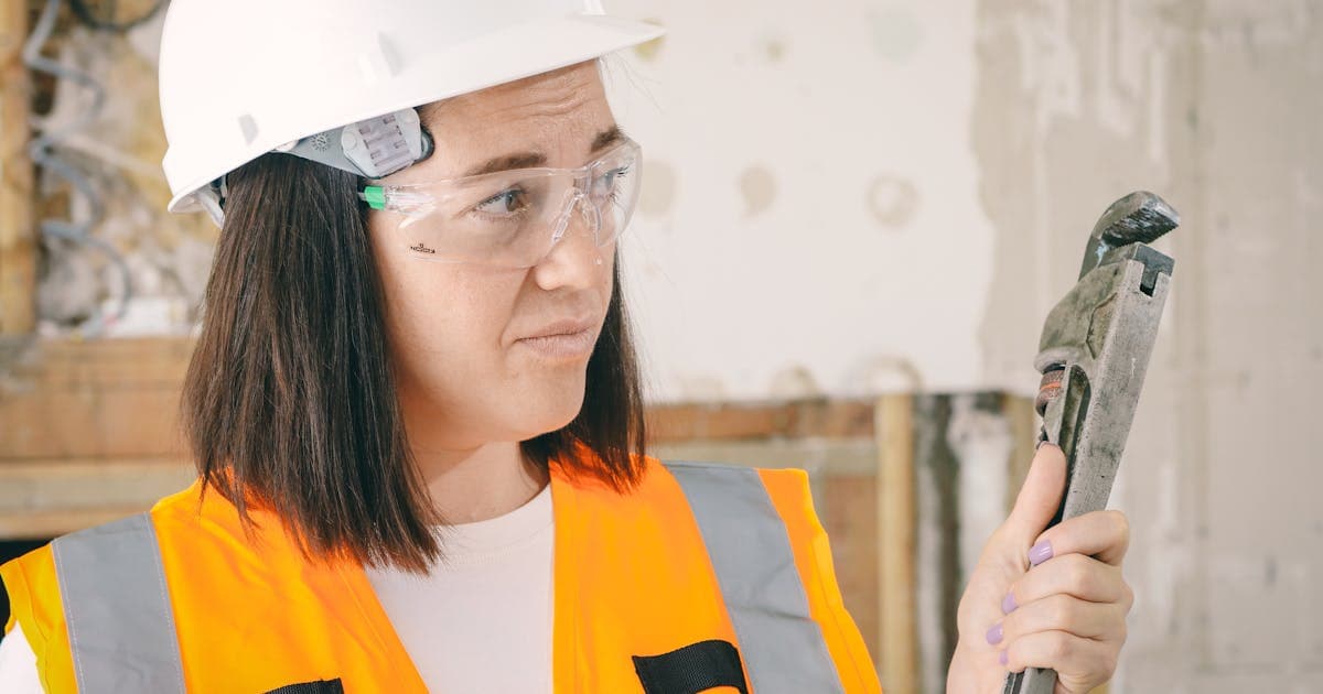 Plumber working on pipe installation