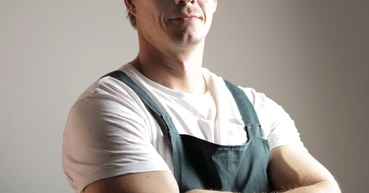 Arborist removing a large tree in a residential yard